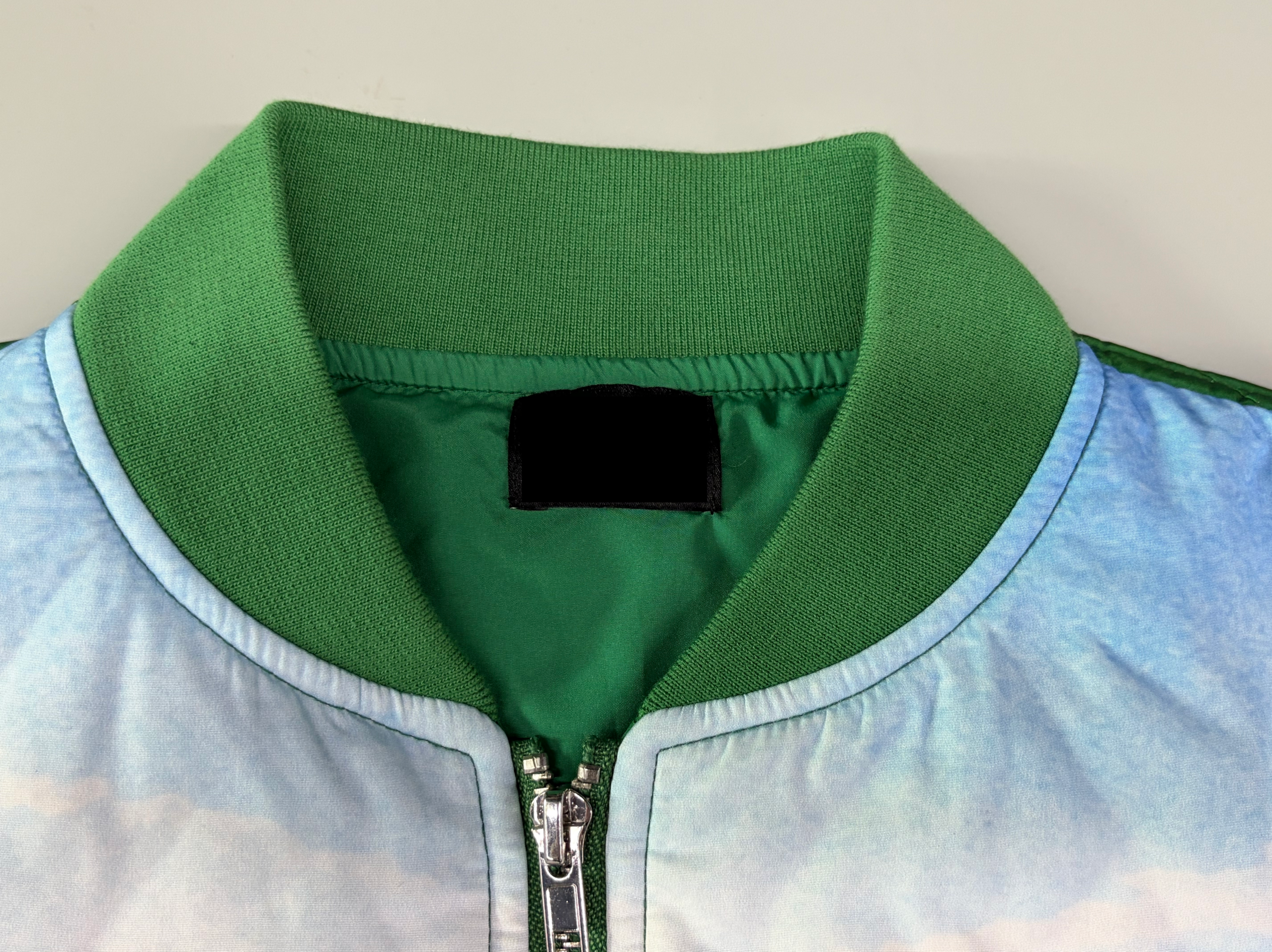 Bomber jacket ribbed collar cuffs and hem construction