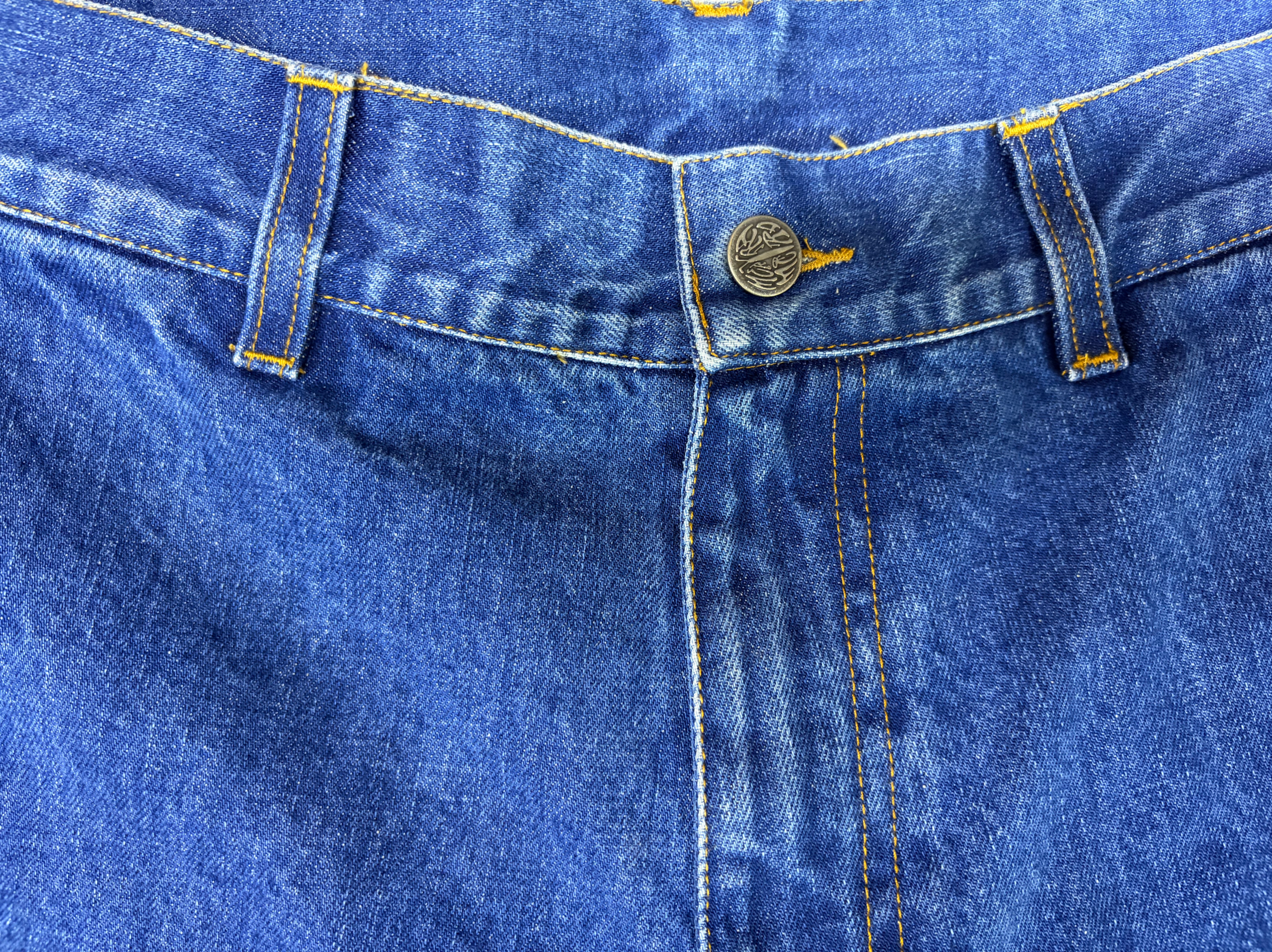 Denim shorts waistband and fly construction detail
