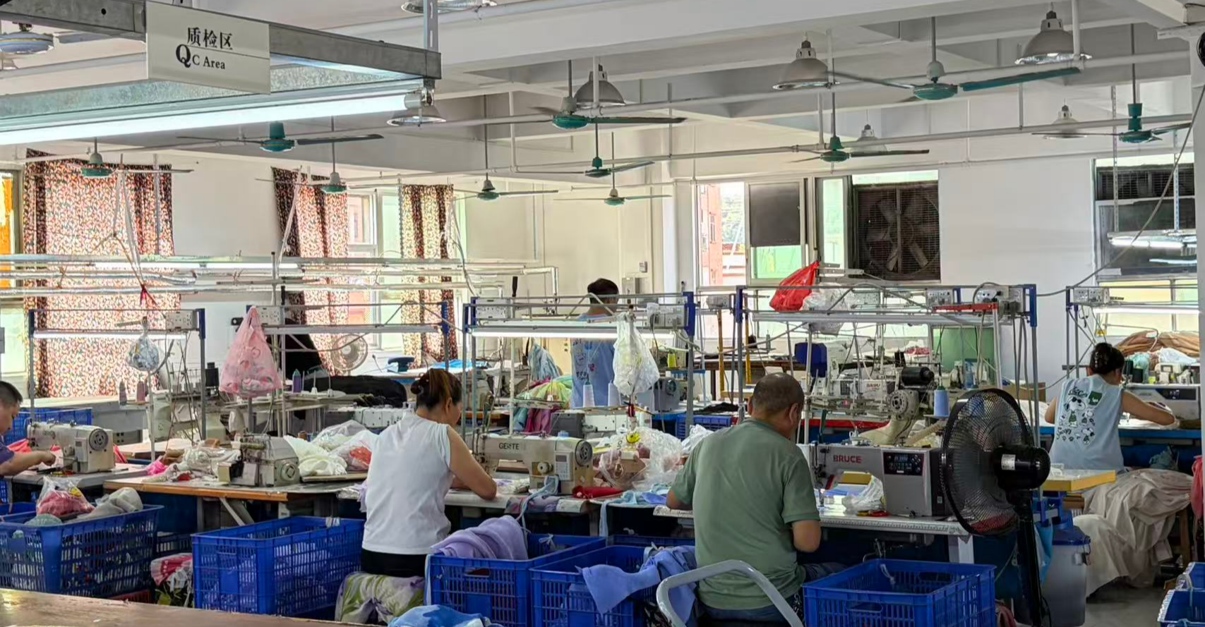 Garment production workshop with cutting and sewing operations