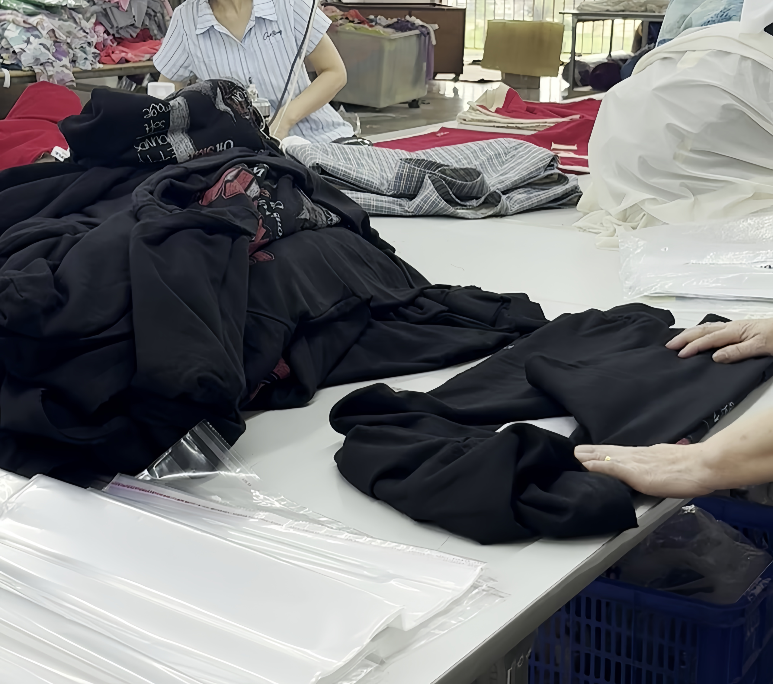 Final garment inspection before folding and packing
