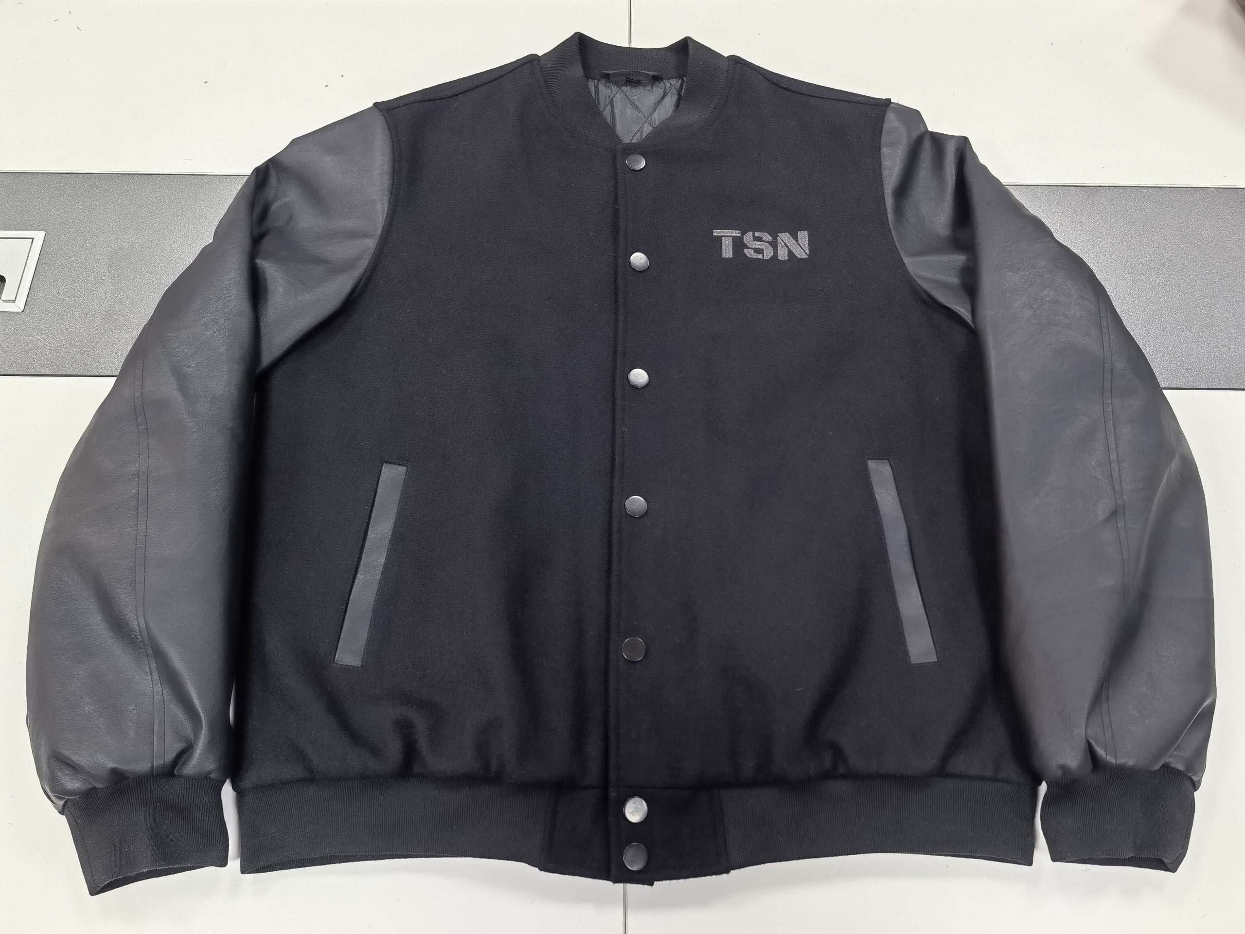 Custom varsity jacket fit and branding details