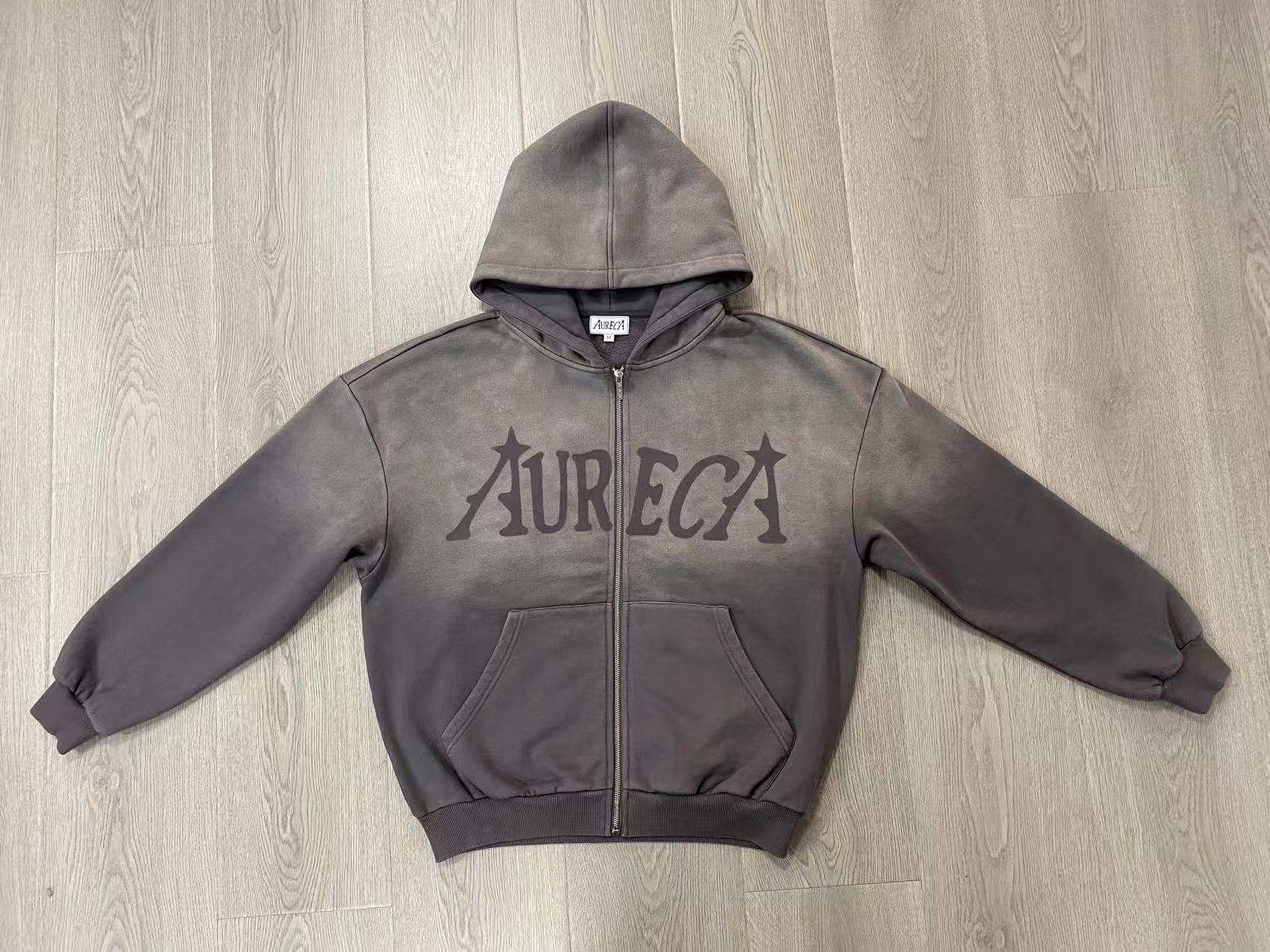 Zip-up hoodie construction showing hood, front zipper, split pockets and ribbed hem