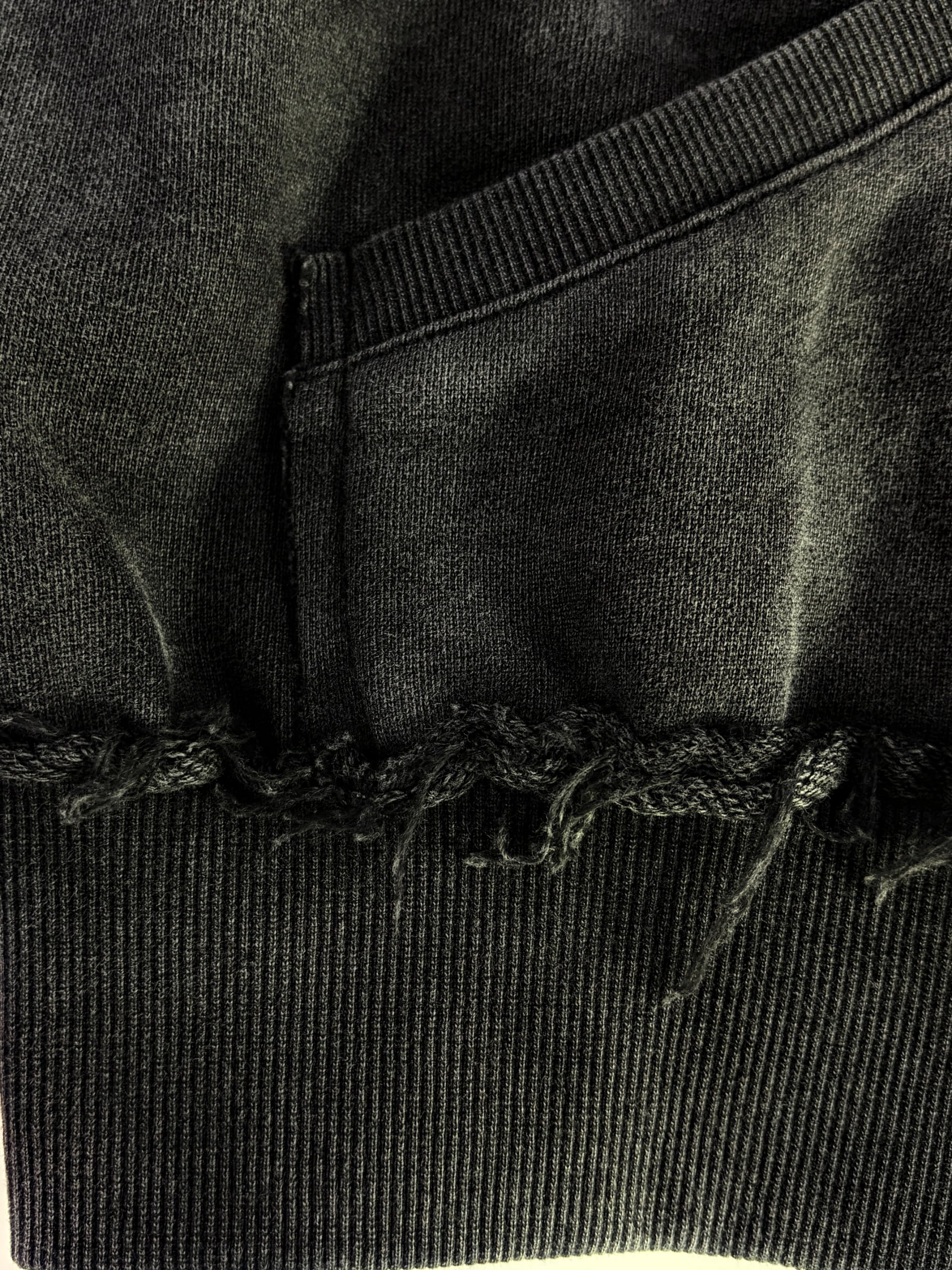 Ribbed cuff and hem construction on a custom zip-up hoodie